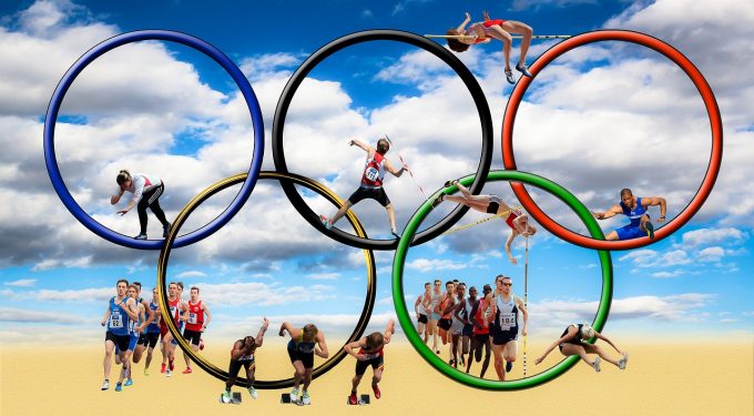 Olympia Olympische Ringe Sportler Wüste Himmel Wolken