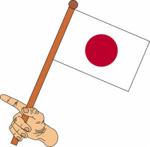 Die japanische Flagge in einer Hand